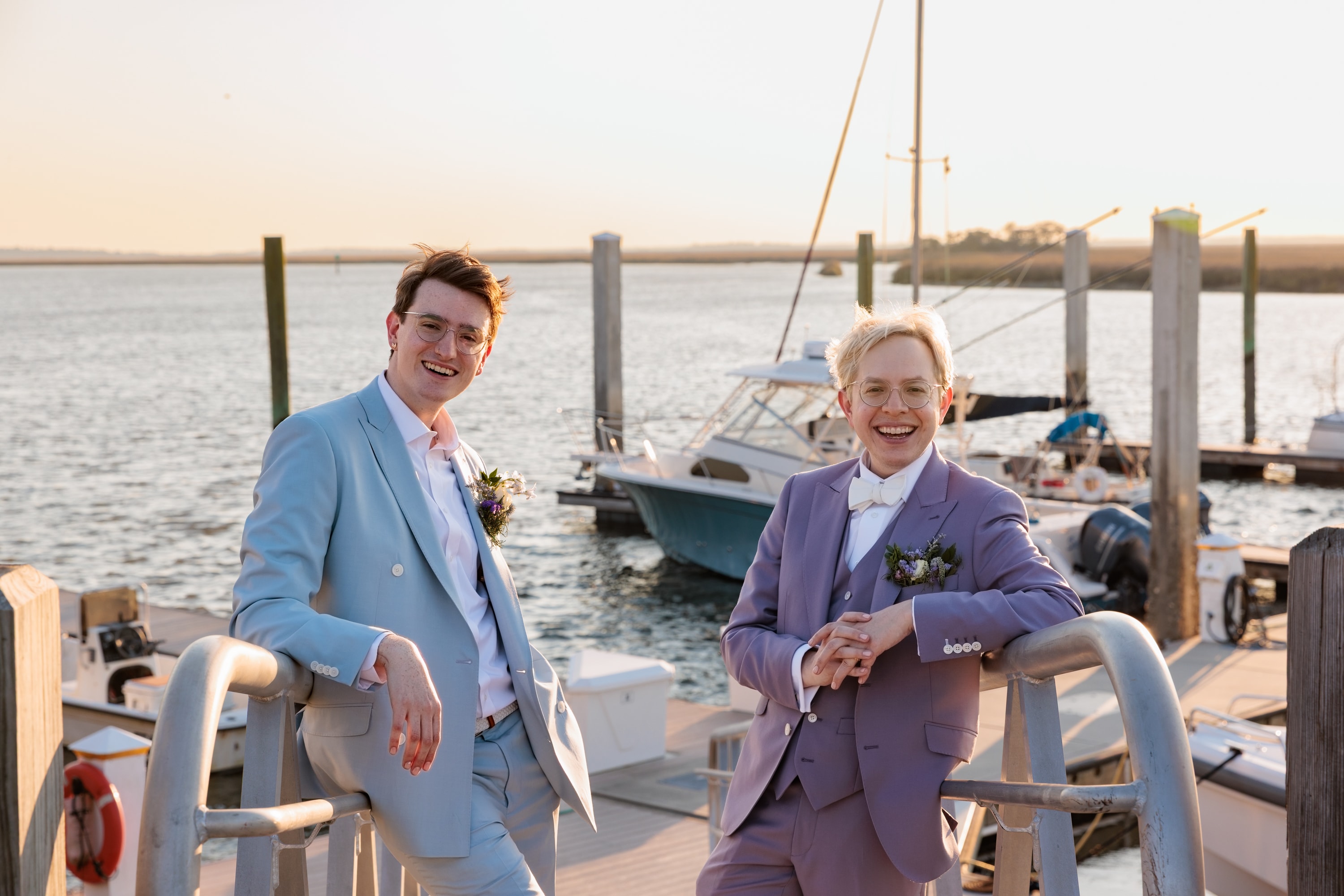 Tyler Cobbs and Derek, co-hosts of How They Think, at a marina